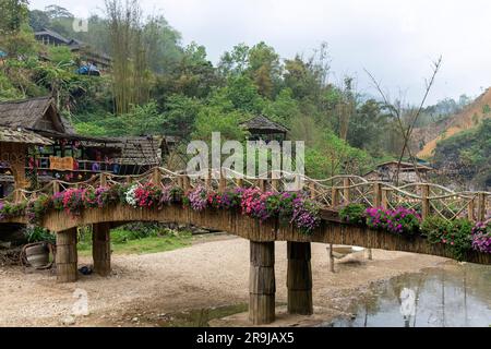 Cat Cat Village, Sapa, Vietnam-April 2023; Bridge over the river in the traditional village of Cat Cat know for its Water wheels for power generation Stock Photo
