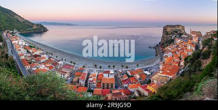 Scilla, Italy on the Mediterranean coast at twilight with seasonal flowers. Stock Photo