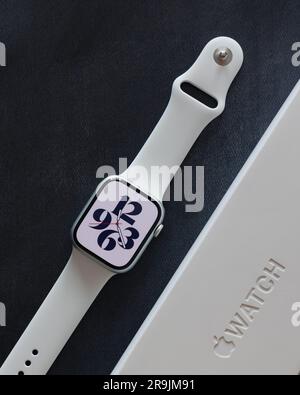 LONDON JUNE 25 2023 Apple Watch with white band strap and time