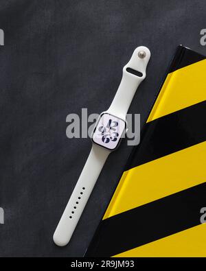 LONDON JUNE 25 2023 Apple Watch with white band strap and time