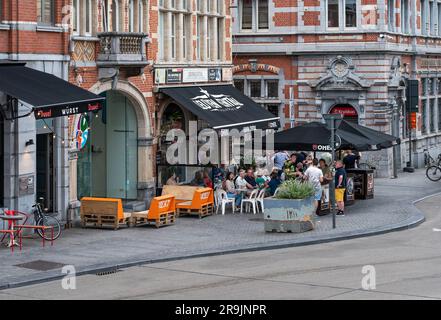 Leuven, Flemish Brabant, Belgium, July 23, 2023 - Students drinking outdoors on a terrace Stock Photo