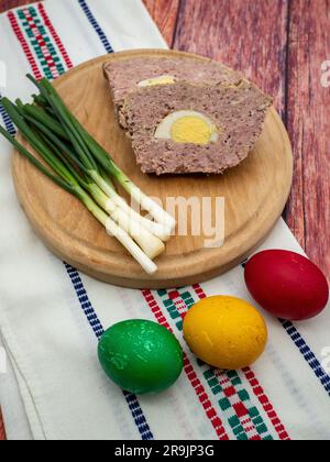 The meat cake, known as drob and easter colored eggs, Romanian easter dishes Stock Photo