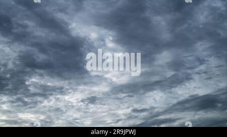Overcast sky. Dramatic gray sky and dark clouds before rain in rainy season. Cloudy and moody sky. Storm sky. Gloomy and moody background. Overcast Stock Photo