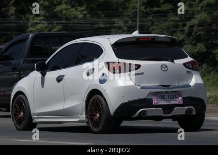 Chiangmai, Thailand -   June  1 2023: Private Eco car Mazda 2. On road no.1001 8 km from Chiangmai Business Area. Stock Photo