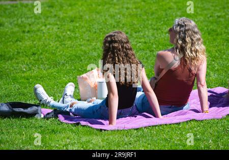 Teens Against Genital Mutilation rally, Hyannis, MA, USA (Cape Cod). Two girls listening. Stock Photo