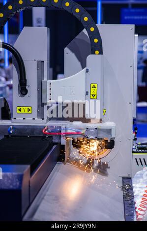 A close-up of a machine cutting metal into small, precise pieces, perfect for industrial projects Stock Photo