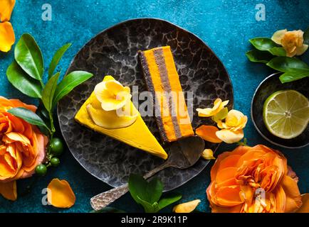 Raw vegan sweet cakes with mango,pineapple, buckthorn and nuts Stock Photo