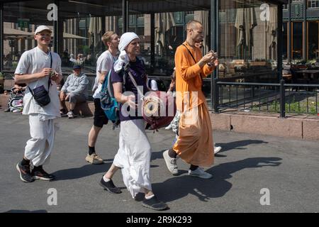 Chanting Hare Krishna devotees on a sunny summer day in Helsinki, Finland Stock Photo