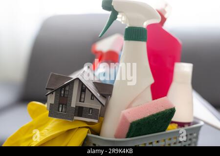 Spring cleaning office or house concept. Different cleaning supplies over  blurred spring background among floating soap bubbles. Copy space Stock  Photo - Alamy