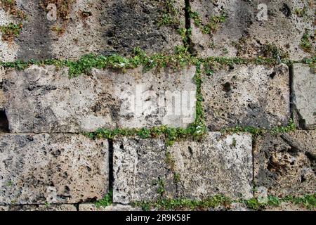 The picture was taken in Germany, in the town of Garmisch-Partenkirchen. In the photo there is an ancient stone wall in the old part of the city. Stock Photo