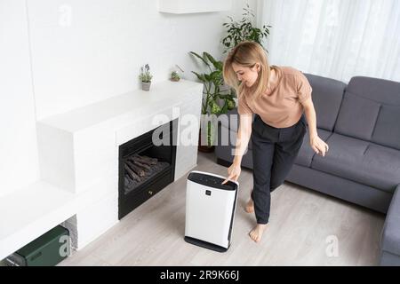 Dehumidifier with touch panel, humidity indicator, uv lamp, air ionizer. Air dryer Stock Photo