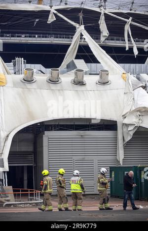 Fireman attend the scene at O2 Arena where the tarpaulin ripped due to the Storm Eunice on Friday 18th February 2022 Stock Photo