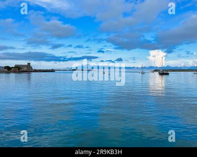 Gulf, yachts anchored in port, clouds in the sky, evening sea. Stock Photo