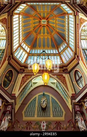 Iconic painted roof of the Leadenhall market. Built in 1881. There are many bars restaurants and shops. Famous tourist sight in London city. Stock Photo