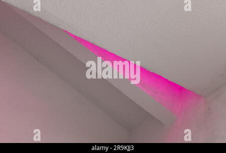 Abstract white minimal interior background with purple illumination in a corner of a niche, architectural photo Stock Photo