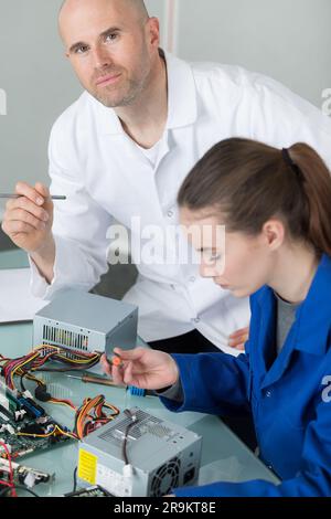 female student in a workshop of electrical engineering Stock Photo