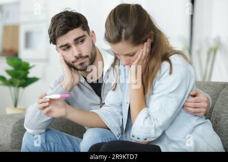 upset couple lover upset about the pregnancy test Stock Photo