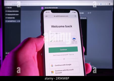Azores, Portugal - 21.01.2023: User holding SmartPhone, while doing email login to ChatGPT service. Developed by OpenAI. Stock Photo