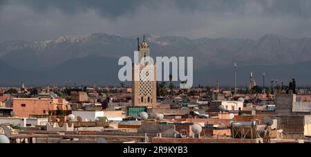 Scenic view of the Marrakech medina and the Atlas mountains in the background during stormy weather, Morocco Stock Photo