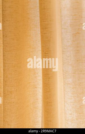 Close-up texture of beige natural linen fabric or curtain Stock Photo