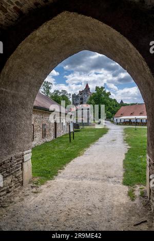 View of the outer courtyard from the arch of the gate at Pernstejn castle Stock Photo