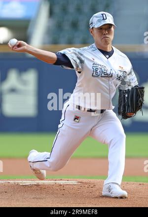 IU throws the opening pitch for the Doosan Bears