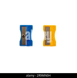 Blue and yellow pencil sharpeners isolated on white, closeup, School supply Stock Photo