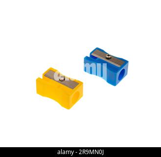 Blue and yellow pencil sharpeners isolated on white, closeup, School supply Stock Photo