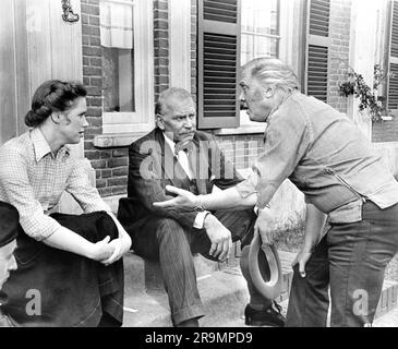 LIV ULLMANN LAURENCE OLIVIER and Director RICHARD ATTENBOROUGH on set candid during filming of A BRIDGE TOO FAR 1977 director RICHARD ATTENBOROUGH screenplay William Goldman based on the book by Cornelius Ryan USA-UK co-production Joseph E. Levine Productions / United Artists Stock Photo