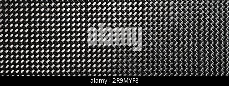 Gray grained carbon fiber background closeup macro Stock Photo