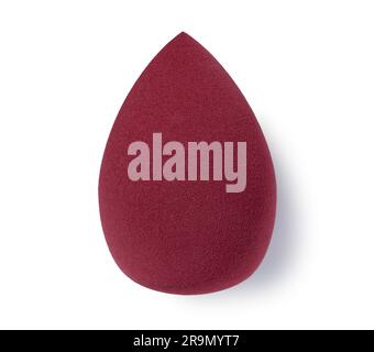 An egg-shaped makeup sponge placed on a white background. Stock Photo
