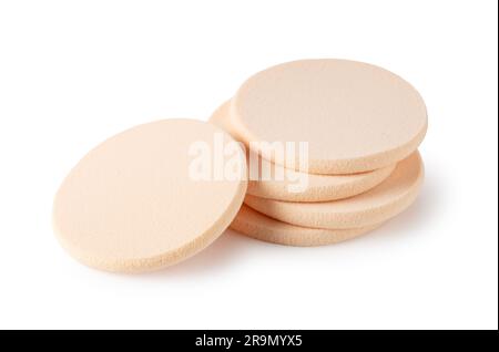 Beige makeup sponge placed on a white background. Stock Photo