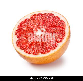 A grapefruit cut in half placed on a white background. Stock Photo