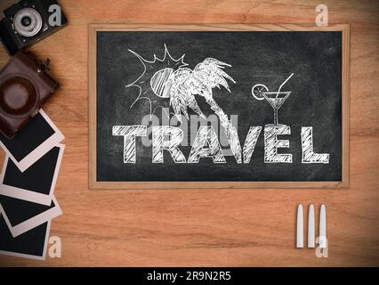 Blackboard with drawing travel concept. Vintage photo camera, cover and blank photo on a wooden table. Stock Photo