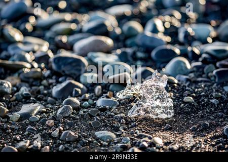 Iceberg pieces and particles near the Diamond Beach in Southern Iceland, tranquility and peace, beauty in nature Stock Photo