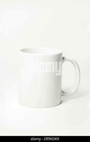 White coffee cup on a white background with copy space for text. Stock Photo