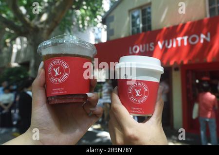 Fans line up to buy coffee at a temporary Louis Vuitton coffee shop in  Shanghai, China Wednesday, June 28, 2023. The French luxury brand has  teamed up with several coffee shops in