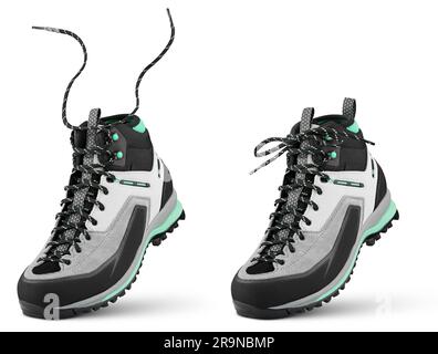 New sports hiking boot with flying laces stands on the tip isolated on white background. Winter trekking shoe with clipping path. Full Depth of Field Stock Photo
