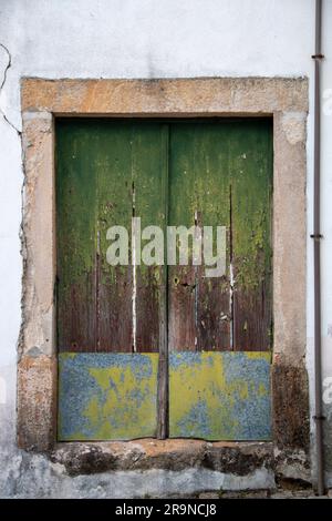 Street of a small town in Portugal where you can see its typical white walls, doors and balconies Stock Photo