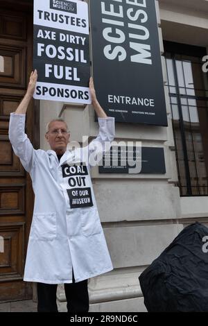 London, UK. 28 June, 2023. Climate activists from Scientists for XR deliver a huge piece of fake coal to the Science Museum and called for it to drop fossil fuel sponsorship from Indian coal giant Adani, UK oil major BP and Norway's Equinor. All three plan to expand fossil fuel extraction despite warnings from the International Energy Agency and the UN that doing so reduces the possibility of combatting global heating. The action coincided with a meeting of the museum Board of Trustees from which Jo Foster and Hannah Fry resigned over Adani sponsorship. Credit: Ron Fassbender/Alamy Live News Stock Photo