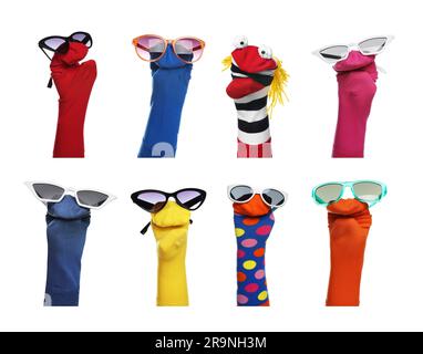 Many colorful sock puppets on white background, collage design Stock Photo