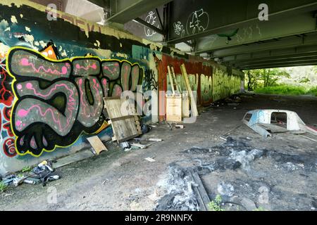 Contrasts. This image of graffiti by the Thames near Oxford does not show the traffic that - day and night - stream past on the bridge, carrying the c Stock Photo