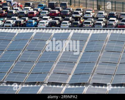 Looking down from a moored cruise ship onto the curved roof of the Horizon Cruise Terminal in Southampton, England, shows an abstract pattern of solar Stock Photo