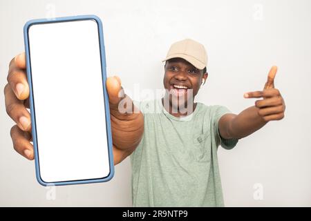 young black man pointing to his phone screen Stock Photo