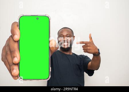 black man showing his phone screen Stock Photo