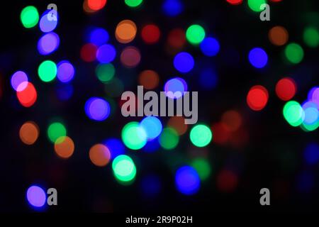 Beautiful bokeh of colorful lights on black background Stock Photo