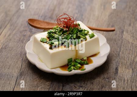 chilled tofu topped with garlic chive soy sauce, Japanese food Stock Photo