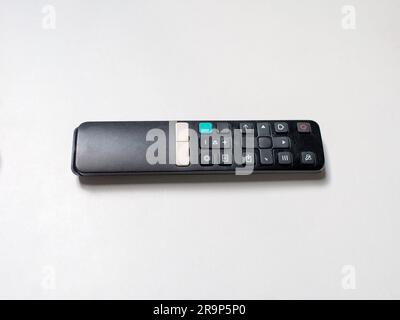A digital tv remote control on white background, with no brand and no logo. Stock Photo