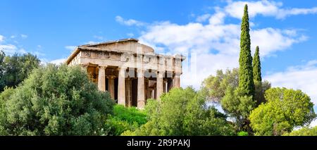 Panorama of temple of Hephaestus in ancient Agora, Athens, Greece. Panoramic view of ancient greek temple of Hephaestus against blue sky background in Stock Photo