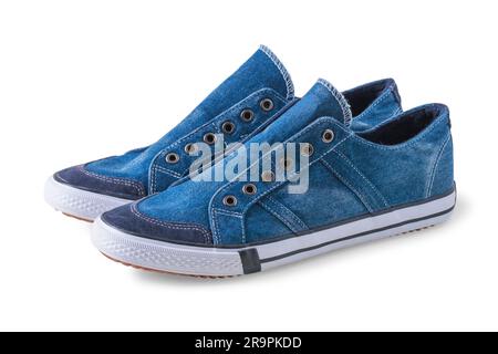 Blue denim sneakers with rubber sole without laces isolated on white Stock Photo